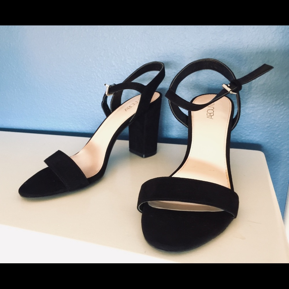 Black open-toed heels.
